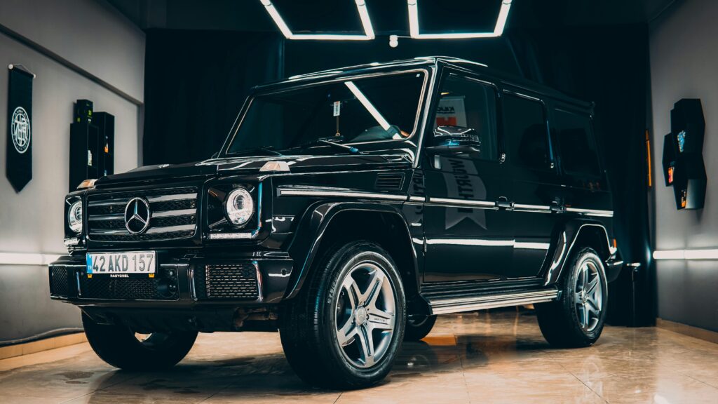 Elegant black Mercedes SUV showcased in a modern indoor setting.
